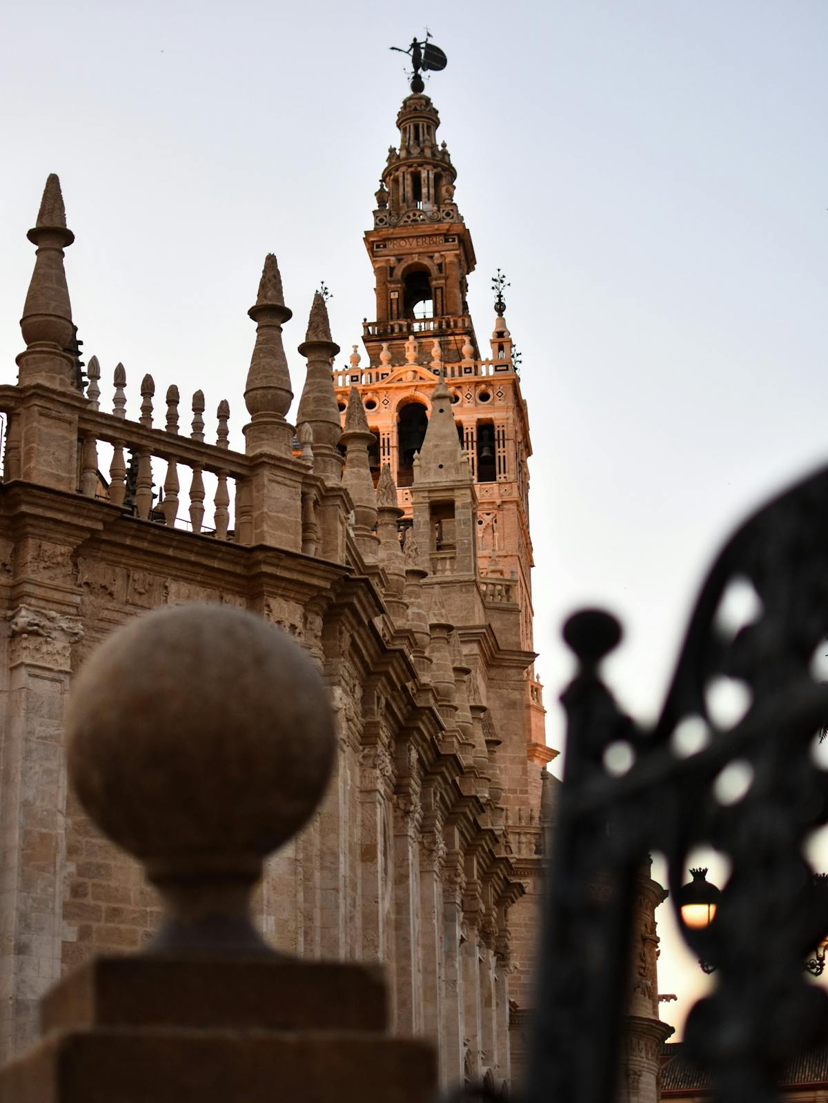 Close-up of ornate stone carving detail on the Seville Cathedral exterior