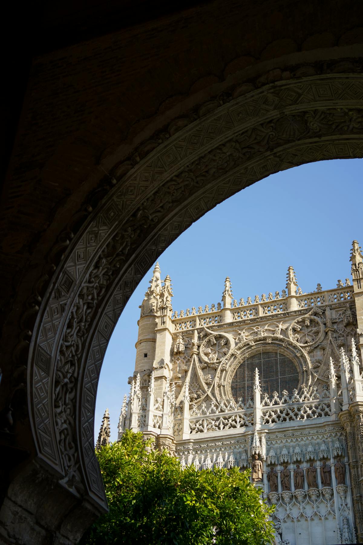 Gilded altarpiece inside Seville Cathedral with intricate carved figures and gold leaf