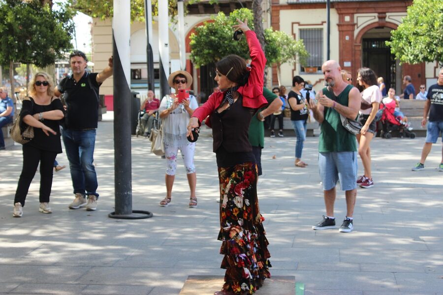 Street flamenco dancers performing in front of an audience in Seville Spain
