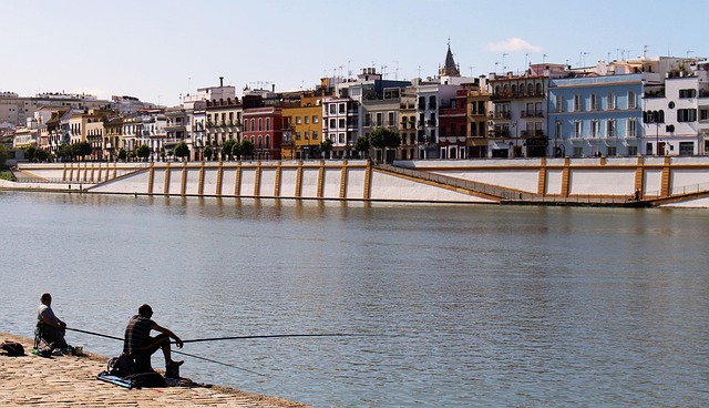 View of the Guadalquivir River with Triana neighbourhood and Gold Tower in Seville