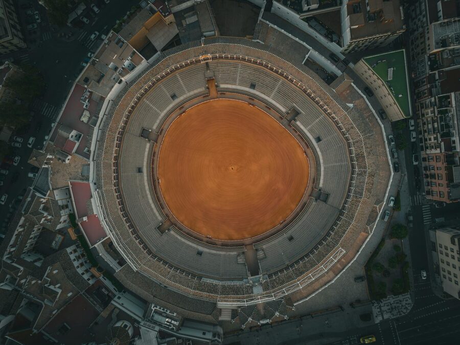 Aerial drone view of the Plaza de Toros de la Maestranza showing its circular shape