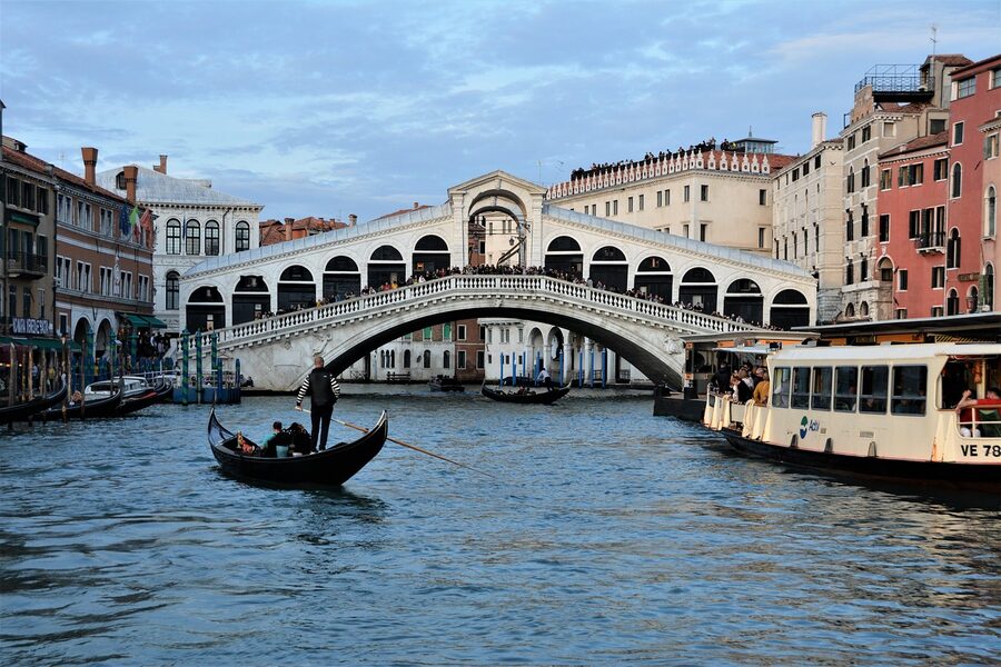 Rialto Bridge in Venice with gondola passing underneath