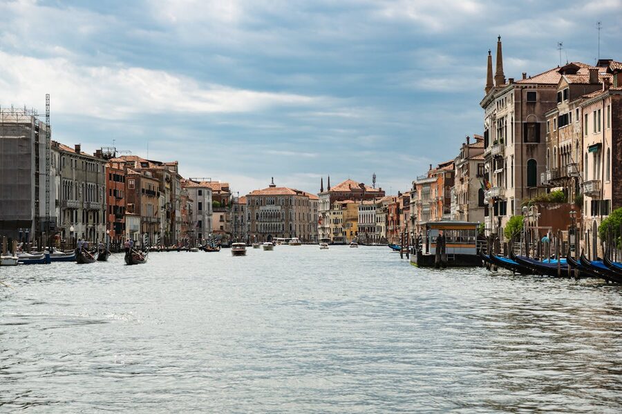 Scenic view of Venice Grand Canal with historic buildings and gondolas