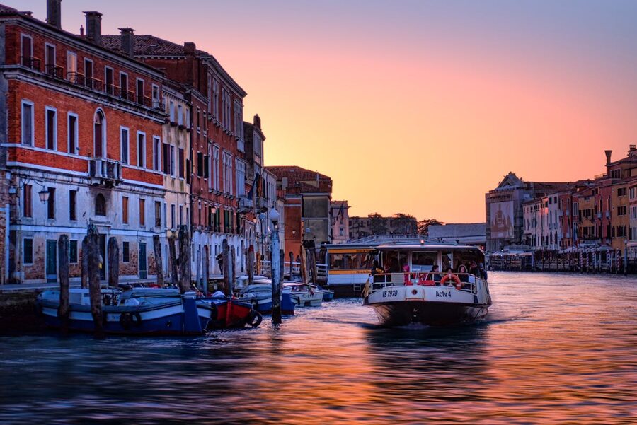 Sunset over Venice Grand Canal with historic buildings and boats