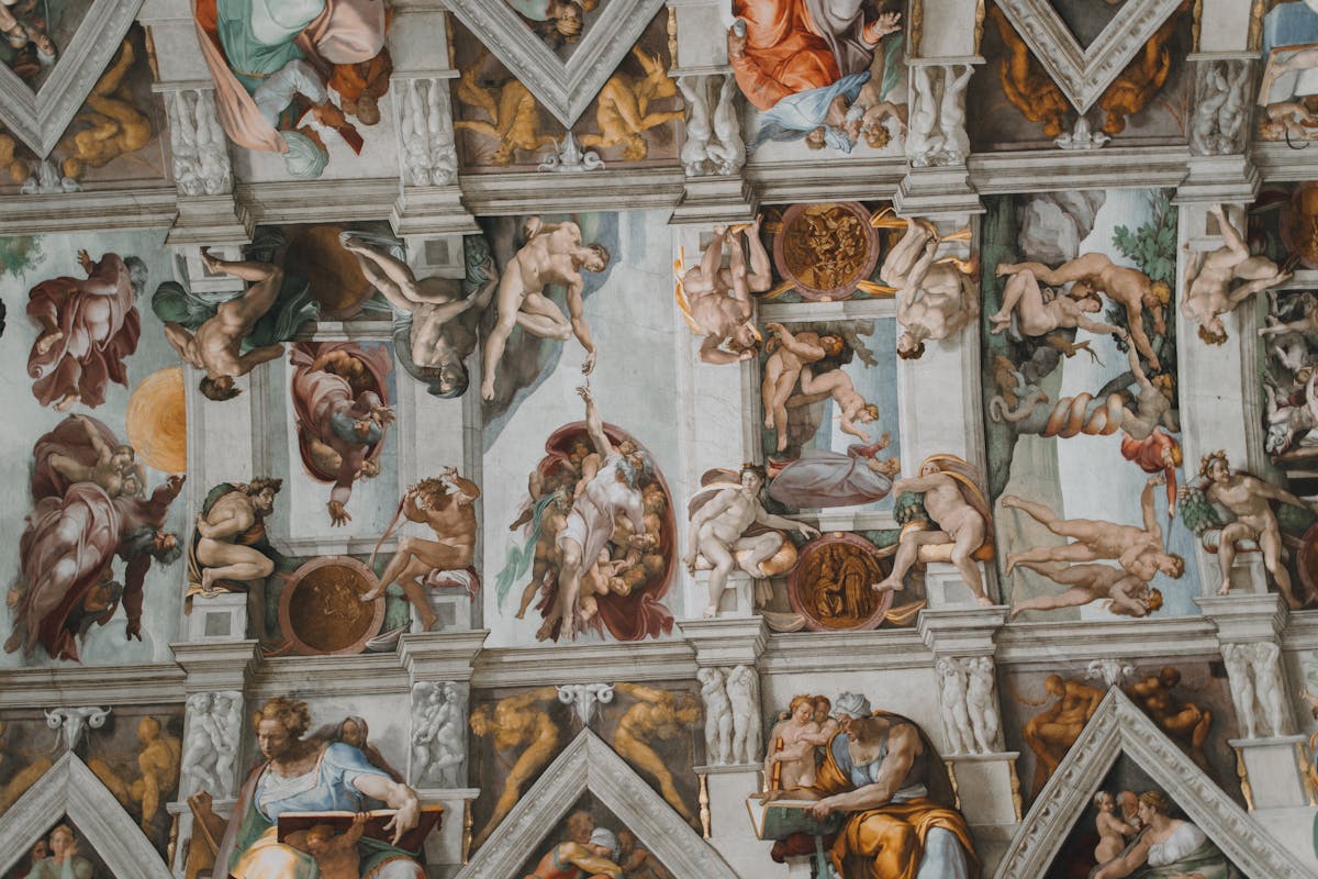 Intricate frescoes on the Sistine Chapel ceiling painted by Michelangelo in Vatican City