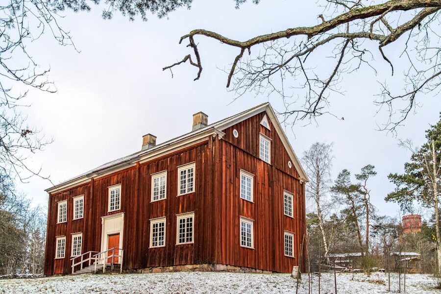 Traditional Swedish wooden house at Skansen Stockholm in winter