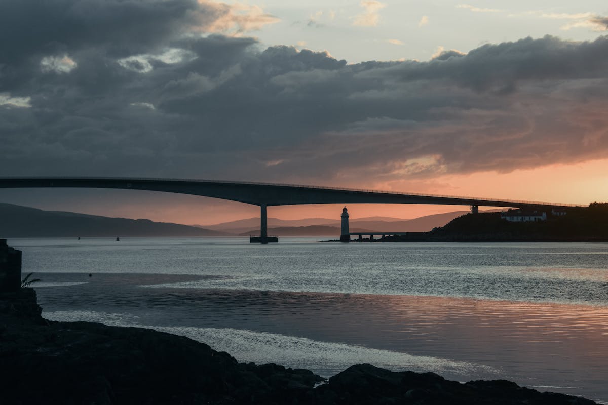 The Skye Bridge at sunset with lighthouse in the background