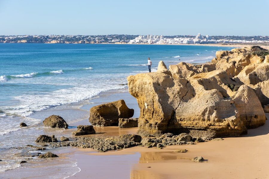 Lagoa Algarve coastline with golden rocks and blue ocean