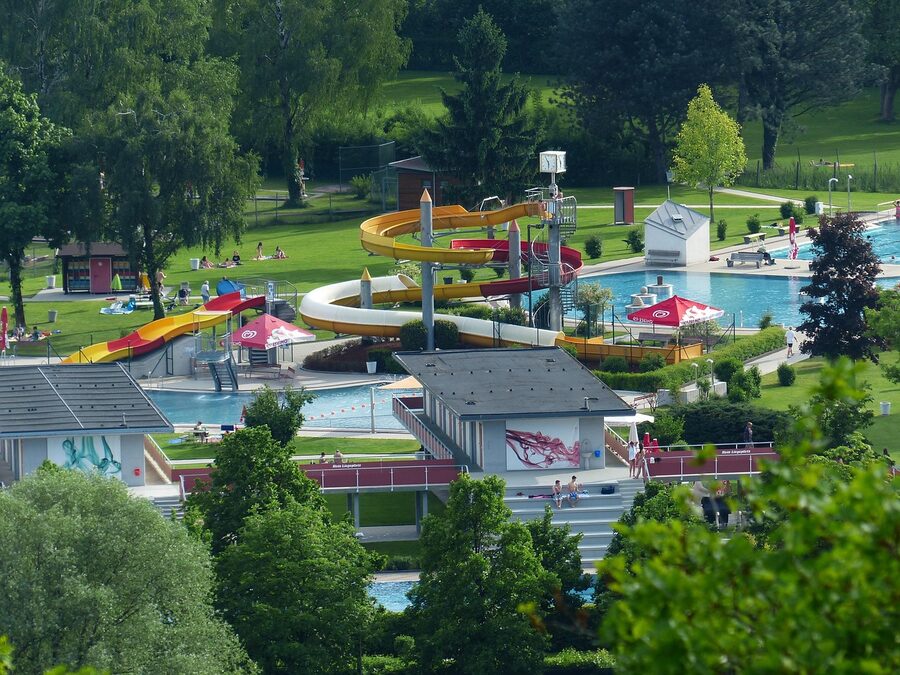 Leisure pool and outdoor waterslide in summer
