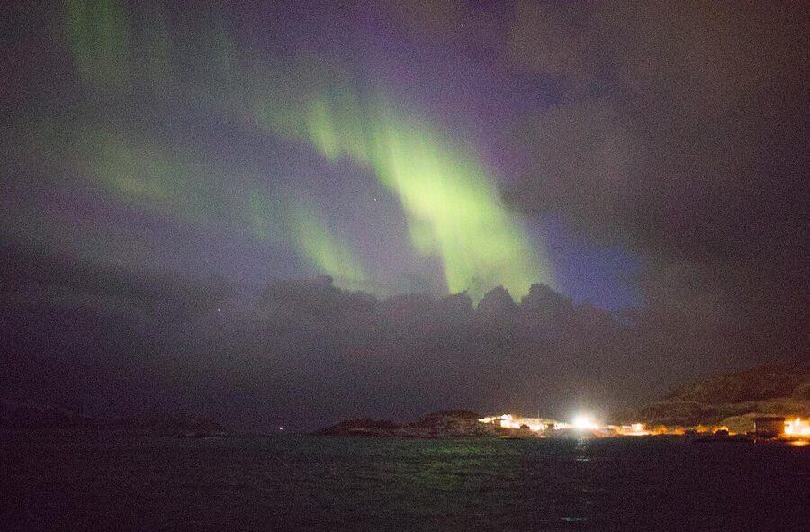 Sommaroy northern lights aurora over the harbour