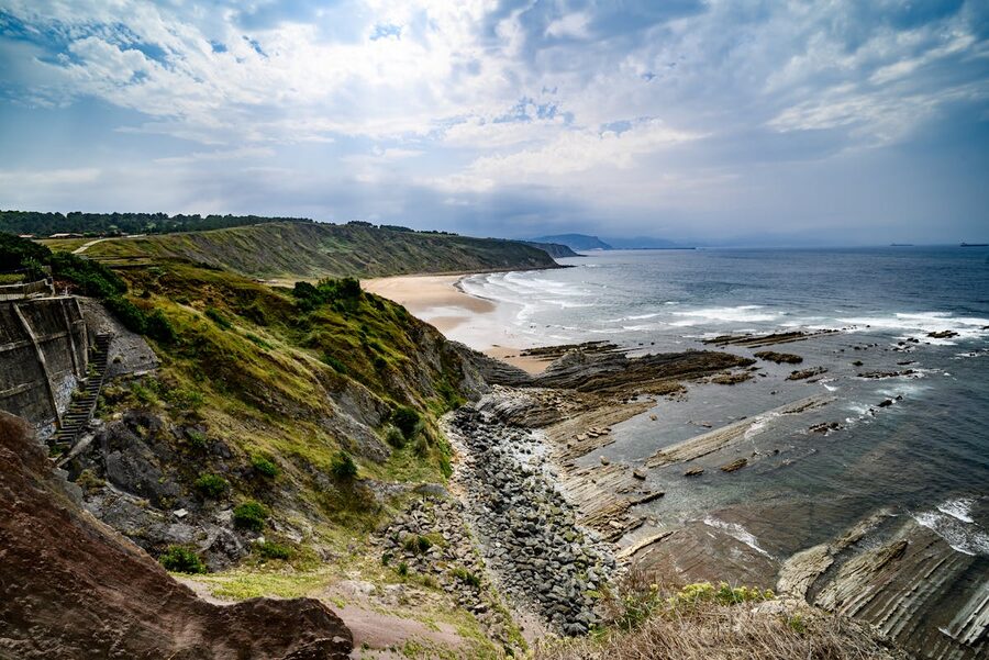 The dramatic cliffs and sandy beach at Sopelana along the Basque Coast near Bilbao