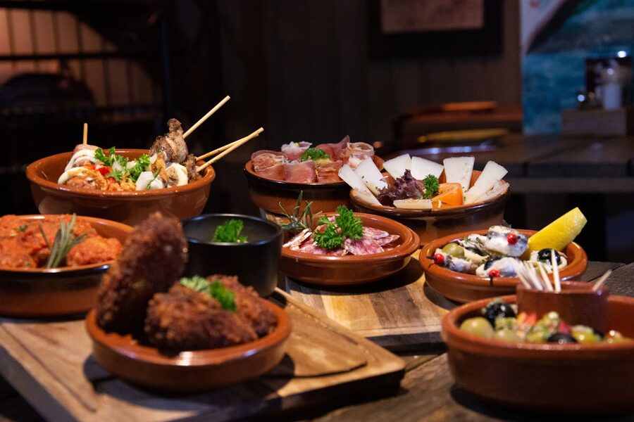 Spread of Spanish tapas dishes on a restaurant table
