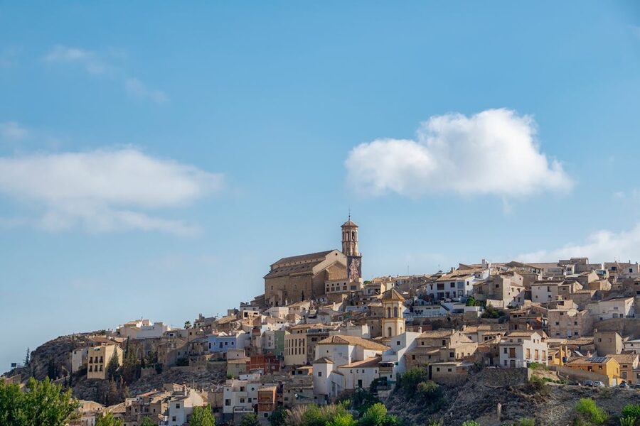 Historic buildings in a sunny Spanish village on a clear day