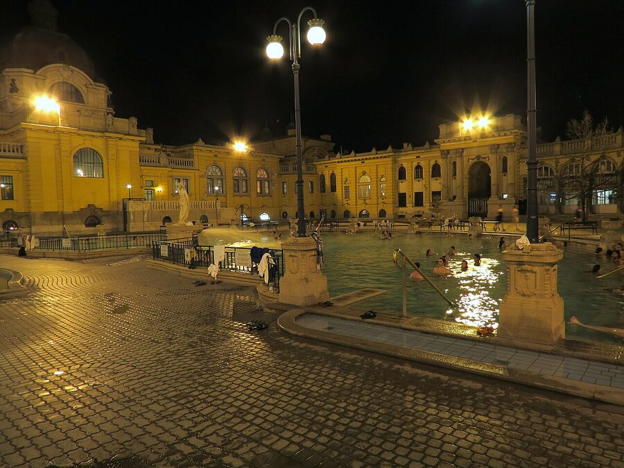 Szechenyi thermal pool glowing at night with steam, Budapest