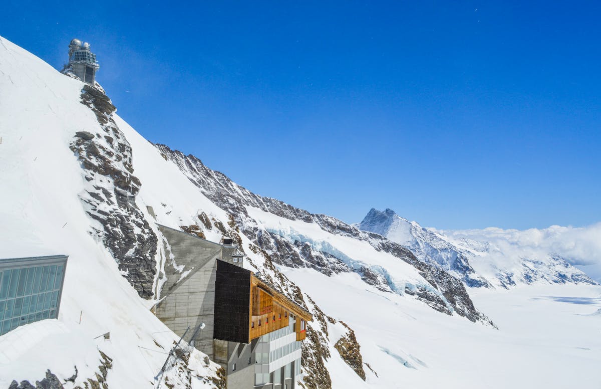 The Sphinx Observatory building perched on a snowy peak at Jungfraujoch in Switzerland