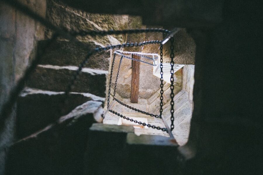 Spiral stone staircase with chains