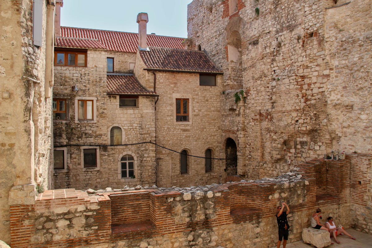 Ancient stone architecture with people in courtyard