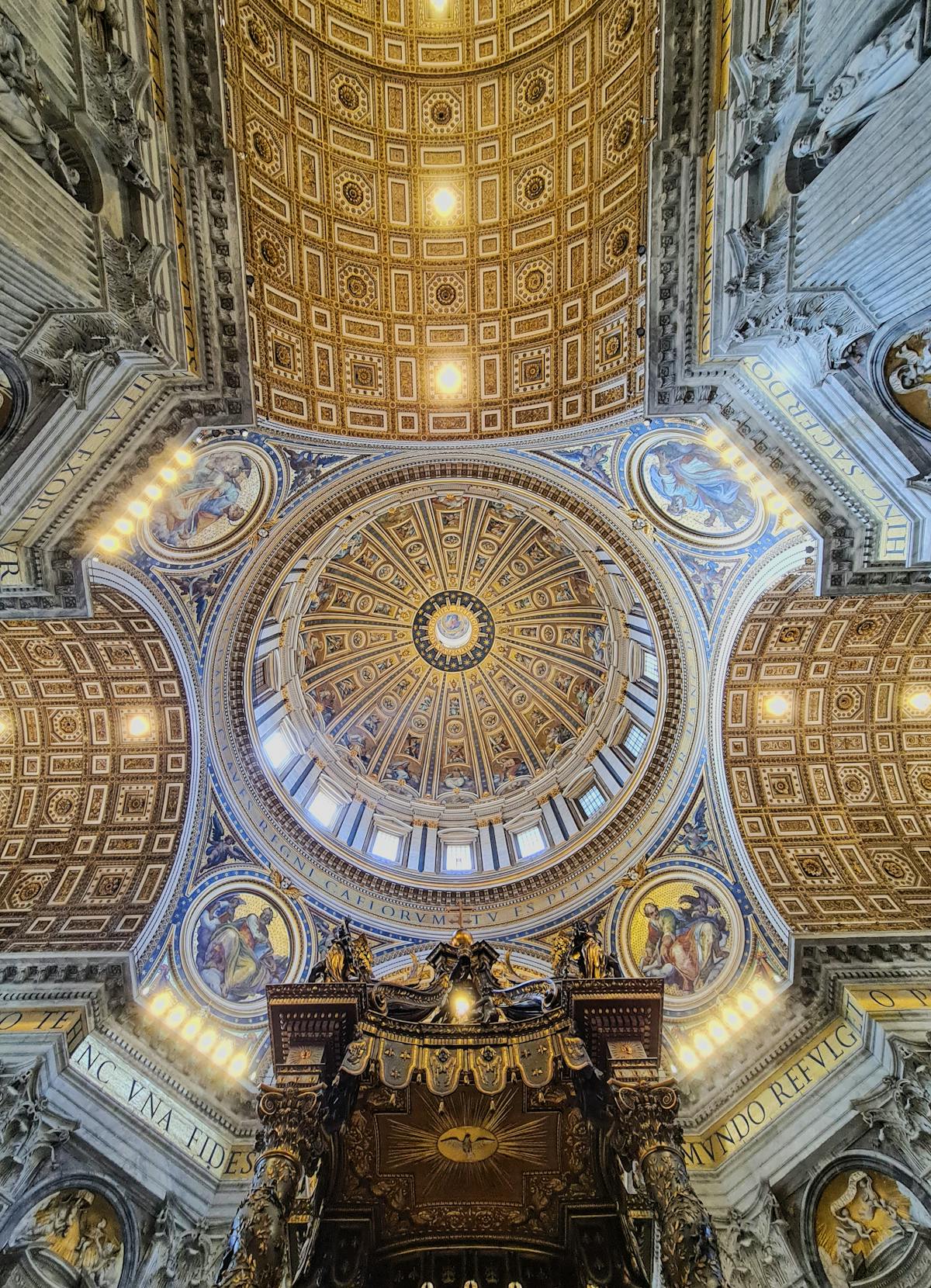 Stunning ornate dome ceiling inside St Peters Basilica in Vatican City