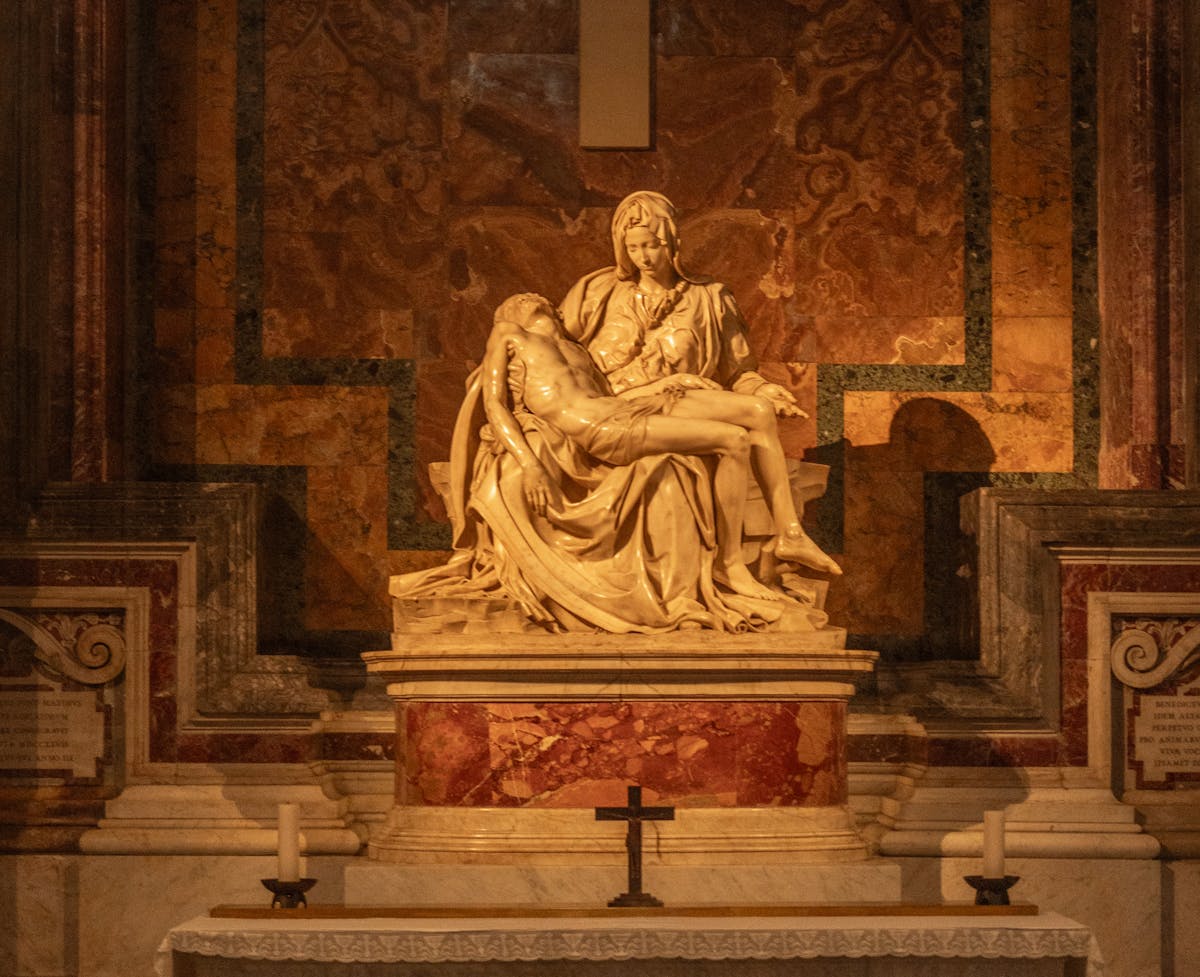 The marble Pieta sculpture by Michelangelo showing Mary holding the body of Christ