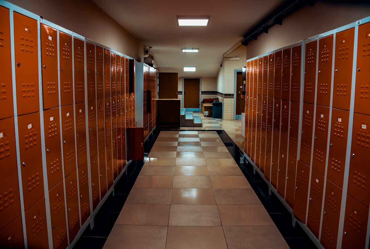 Stadium locker room with lockers and tiled floor