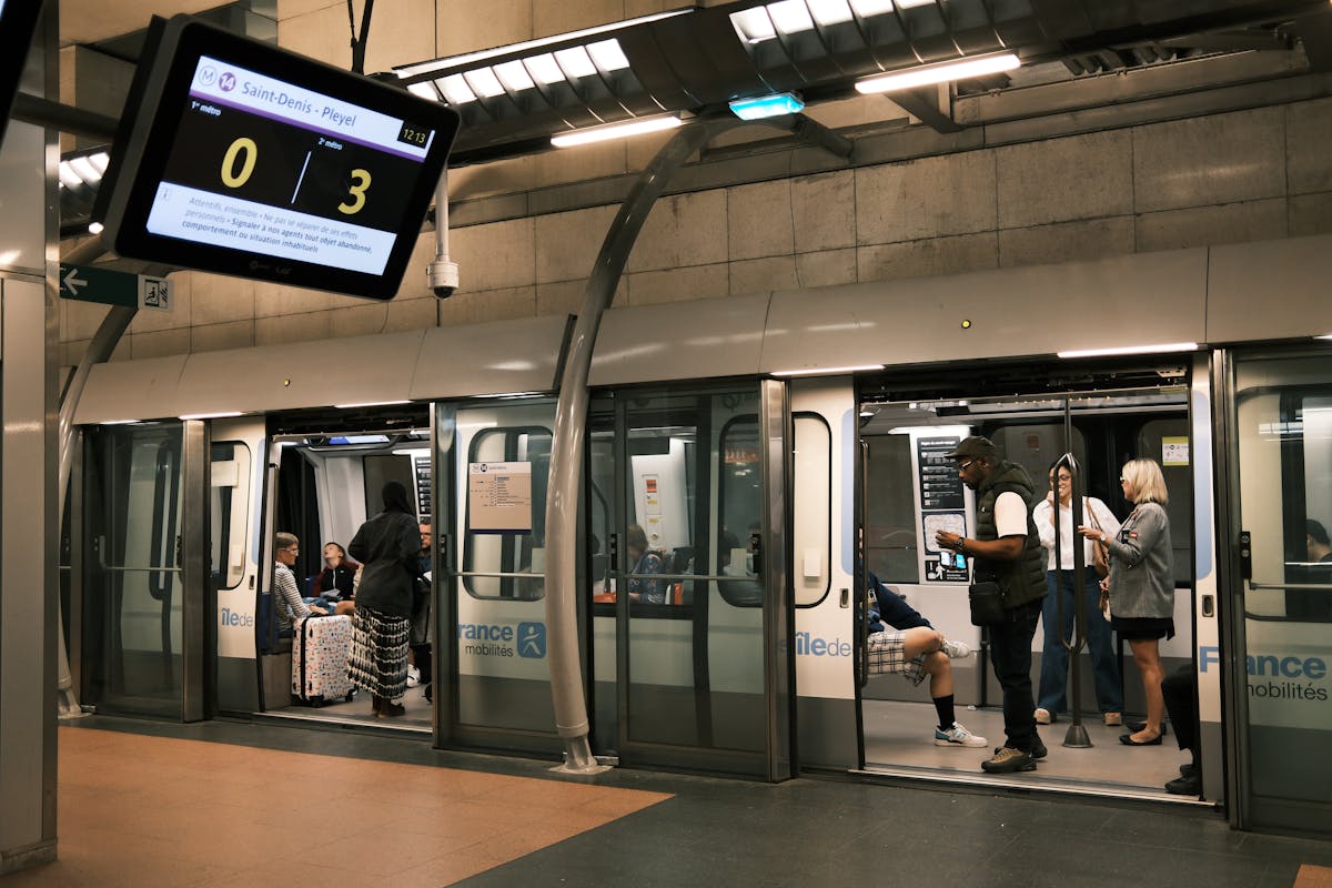Passengers at Saint-Denis metro platform in Paris