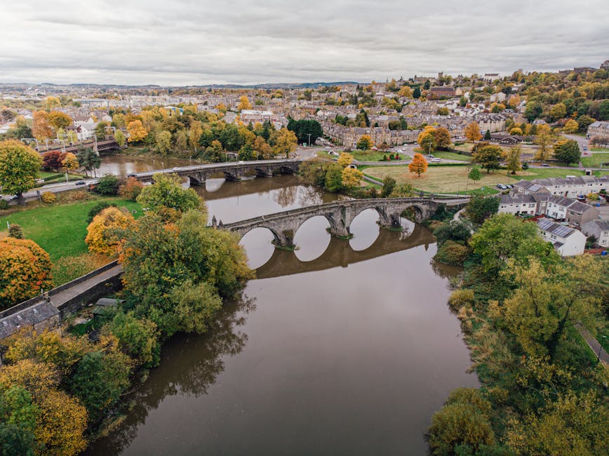 Aerial view of the old Stirling Bridge over the River Forth with autumn foliage