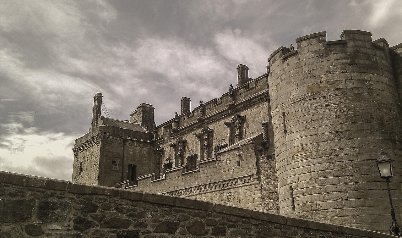 Stirling Castle stone towers and pinnacles under gray cloudy skies