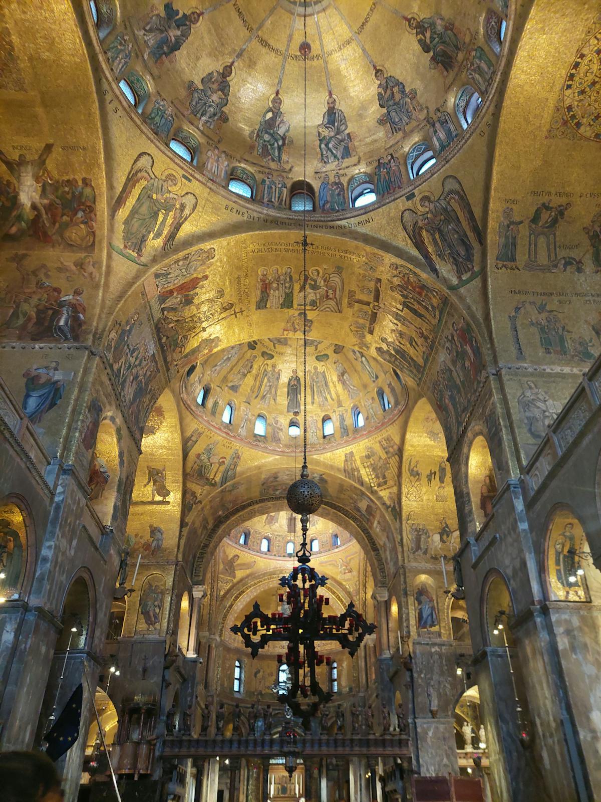 Ornate ceiling mosaic artwork inside St Marks Basilica Venice