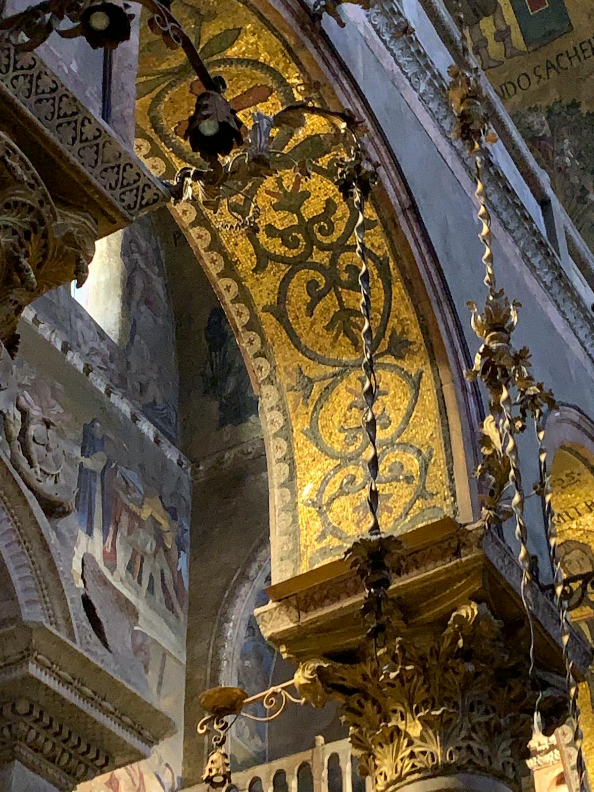 Gold ornate gothic arch detail inside St Marks Basilica Venice