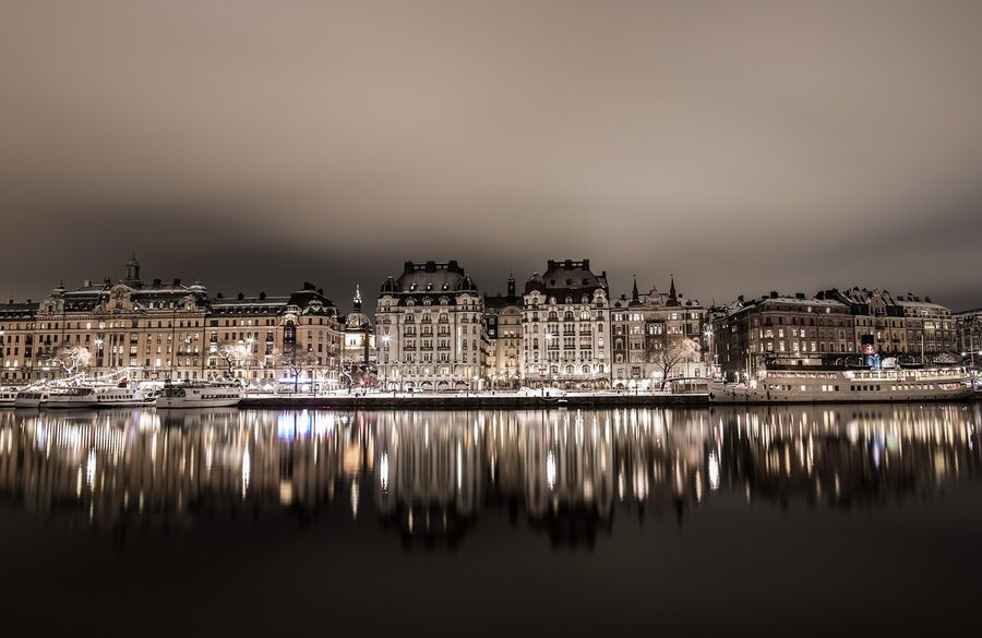 Stockholm at night with city lights reflected in the water