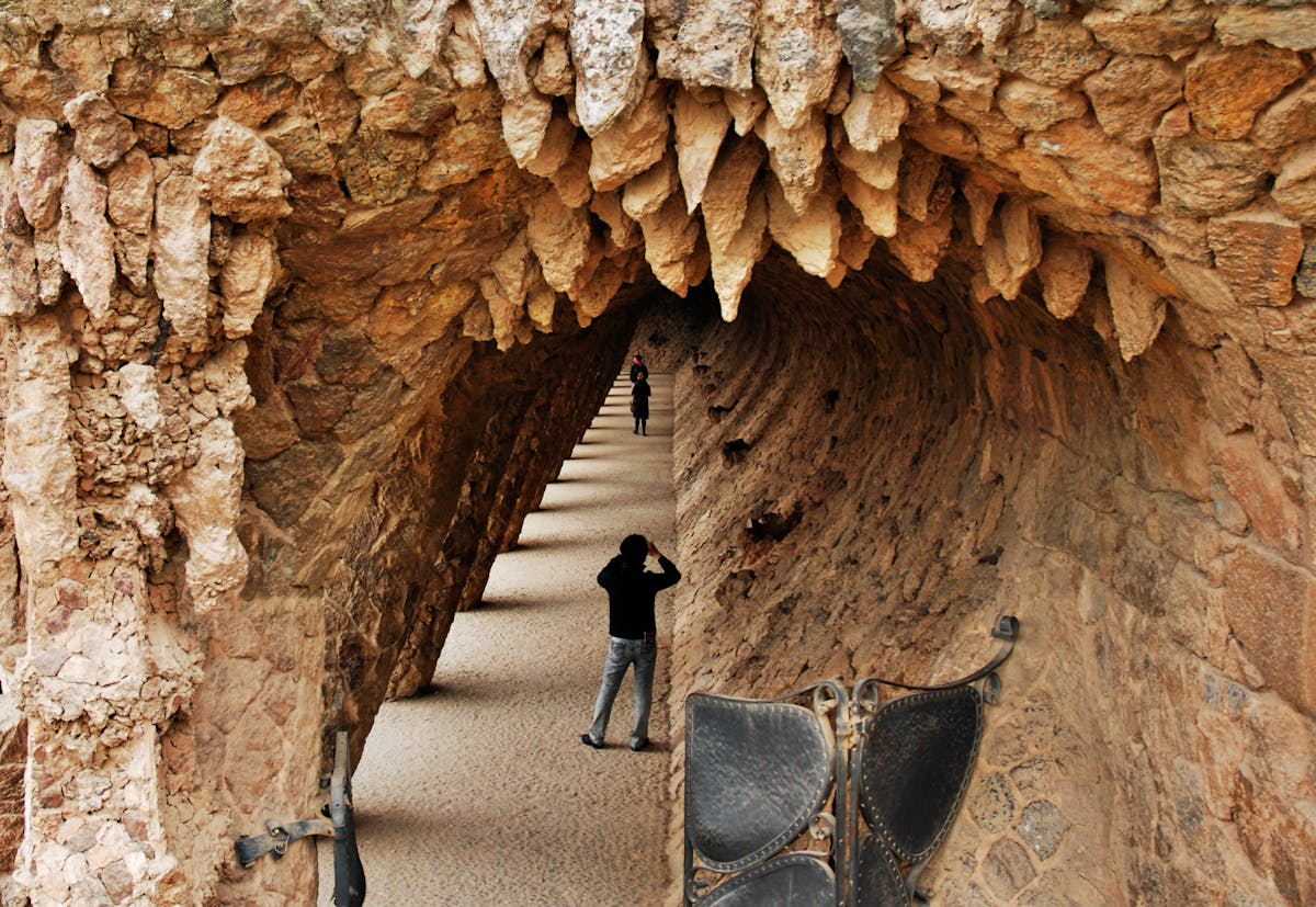 Stone arches and columns along pathways at Park Guell Barcelona