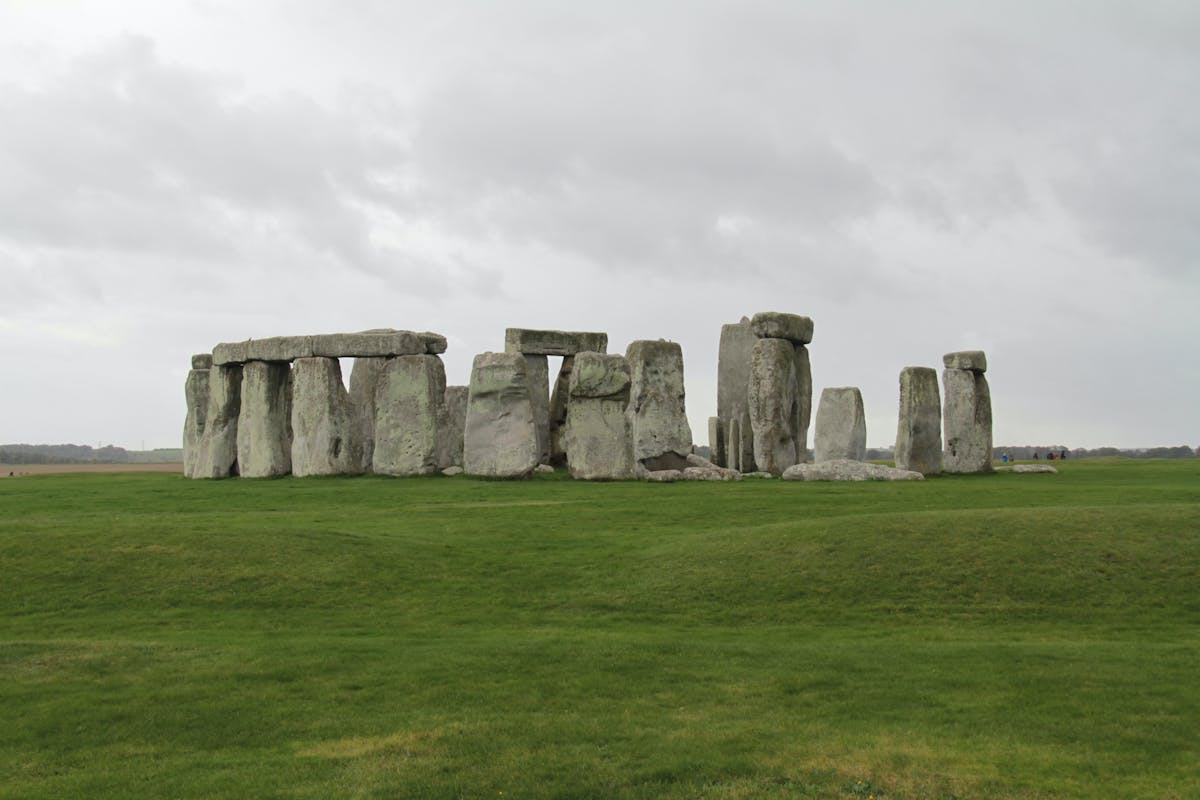 Stonehenge stone circle under dramatic cloudy sky in the English countryside