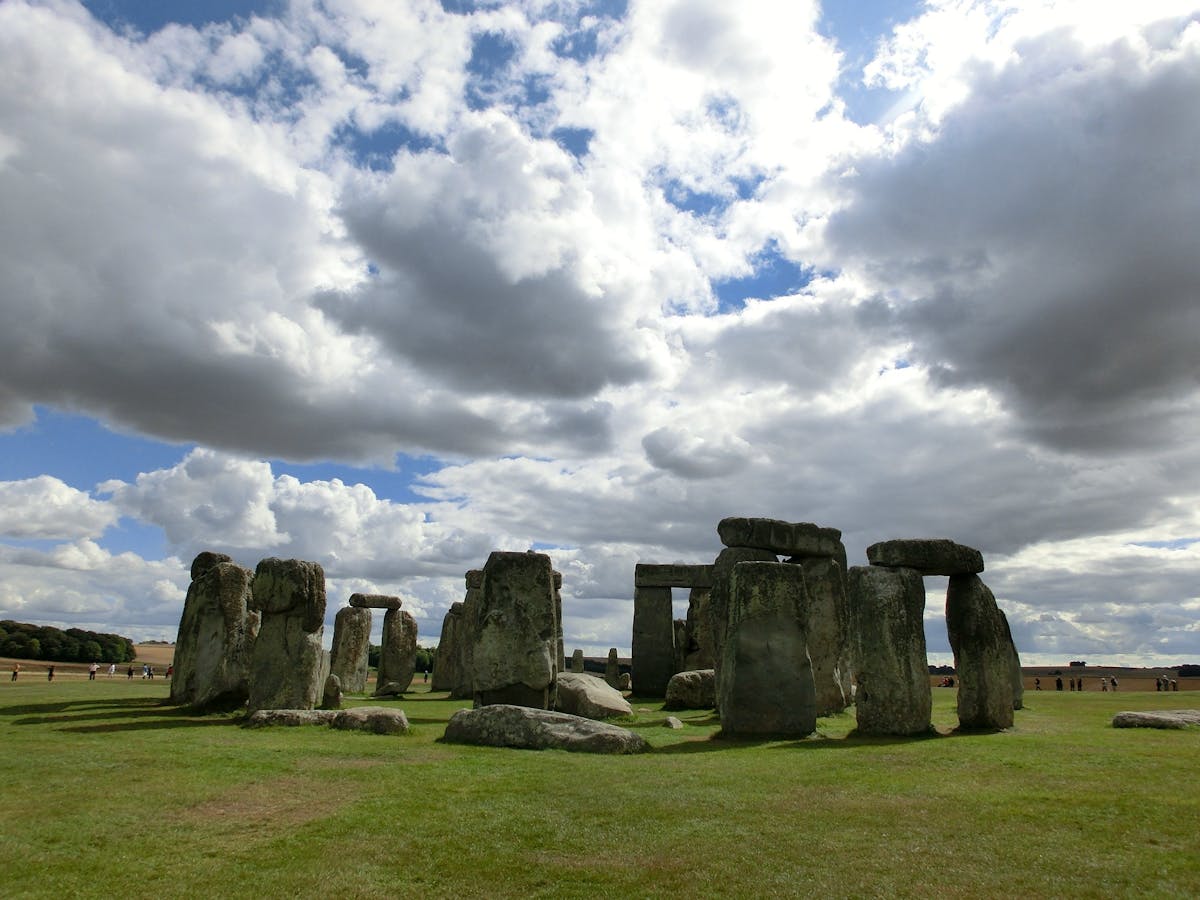 Stonehenge megaliths under cloudy sky in England