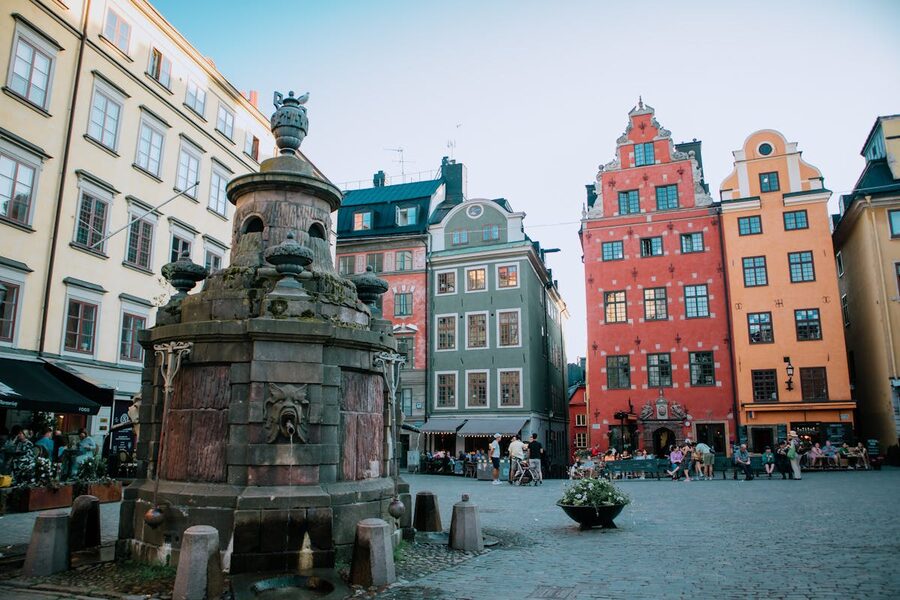 Colorful building facades and fountain in Stortorget Stockholm