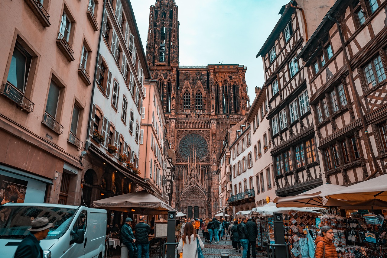 Strasbourg Cathedral exterior facade with surrounding colorful buildings