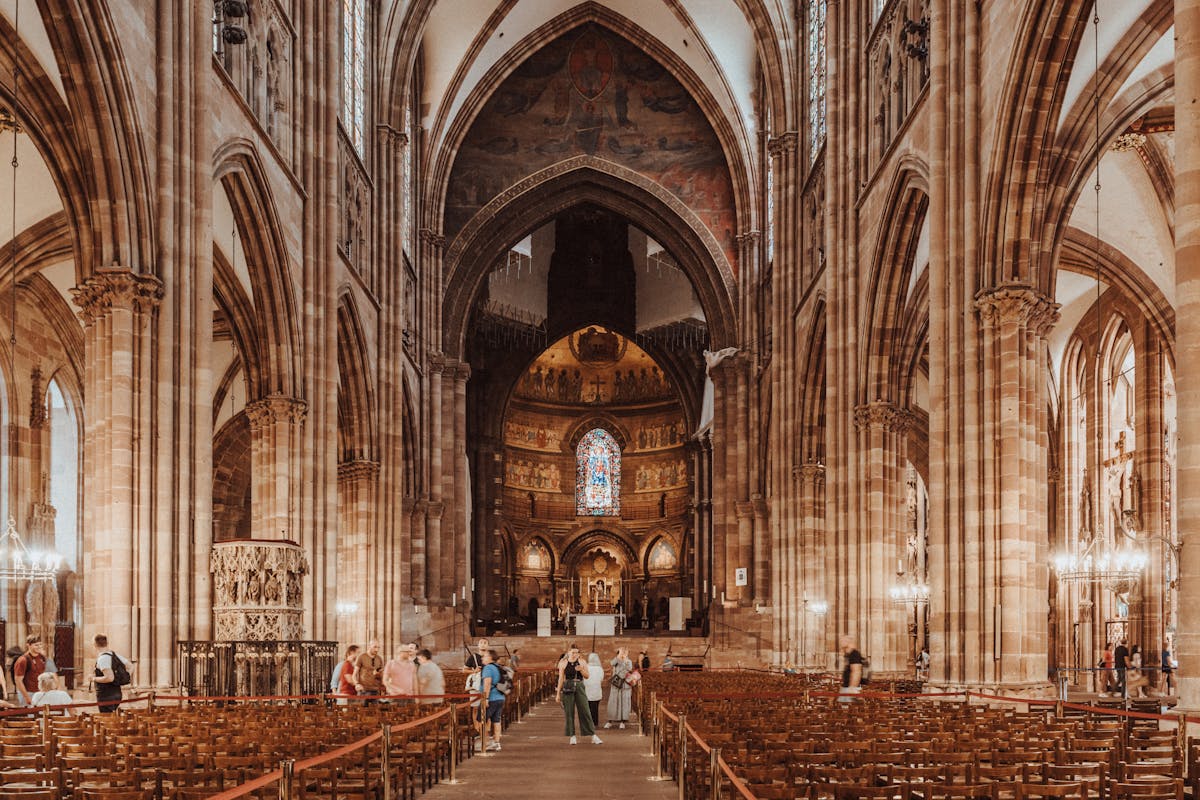 Gothic interior of Strasbourg Cathedral with arches and stained glass