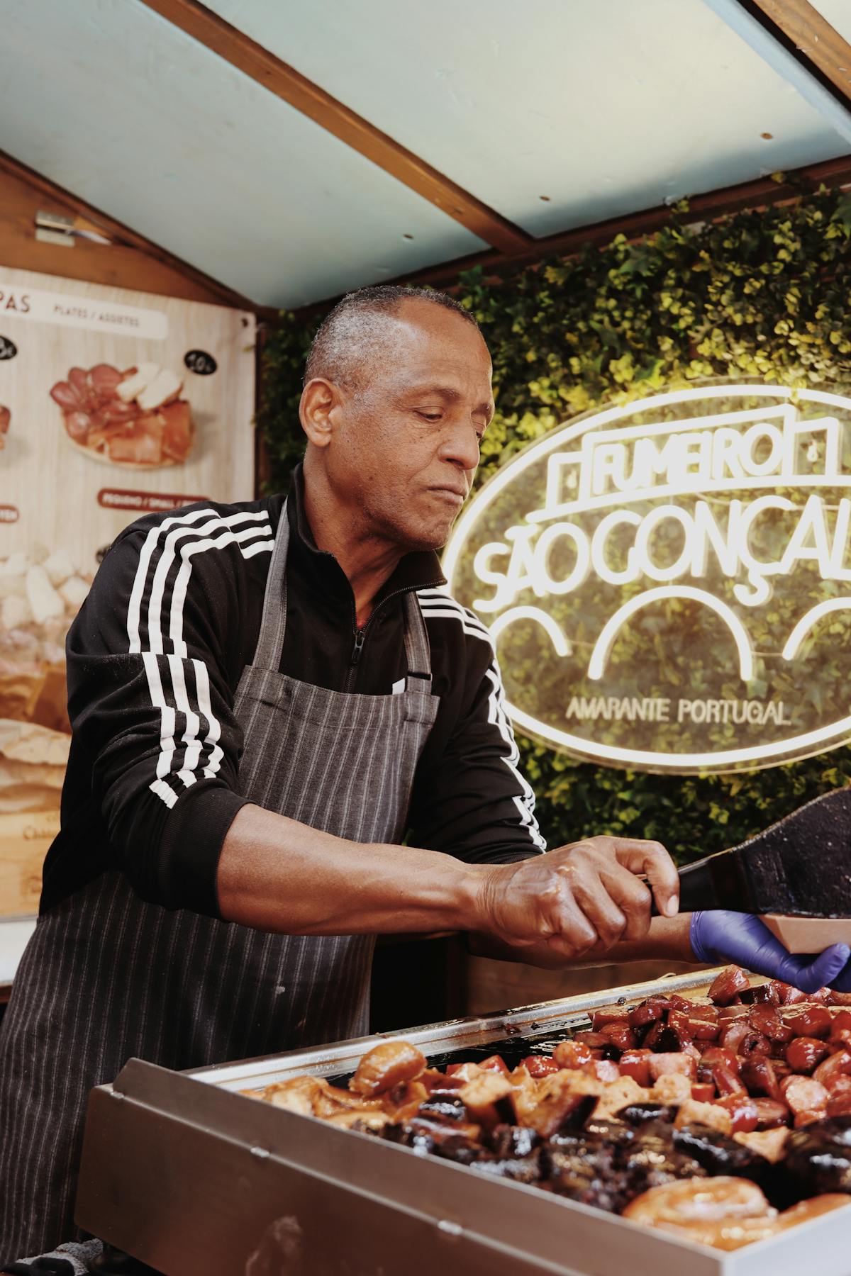 Street food vendor grilling Portuguese food in Lisbon