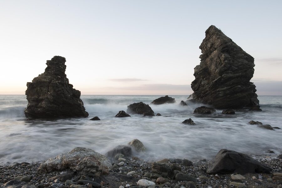 Early morning sunrise illuminating rocky beach formations at Nerja on the Costa del Sol