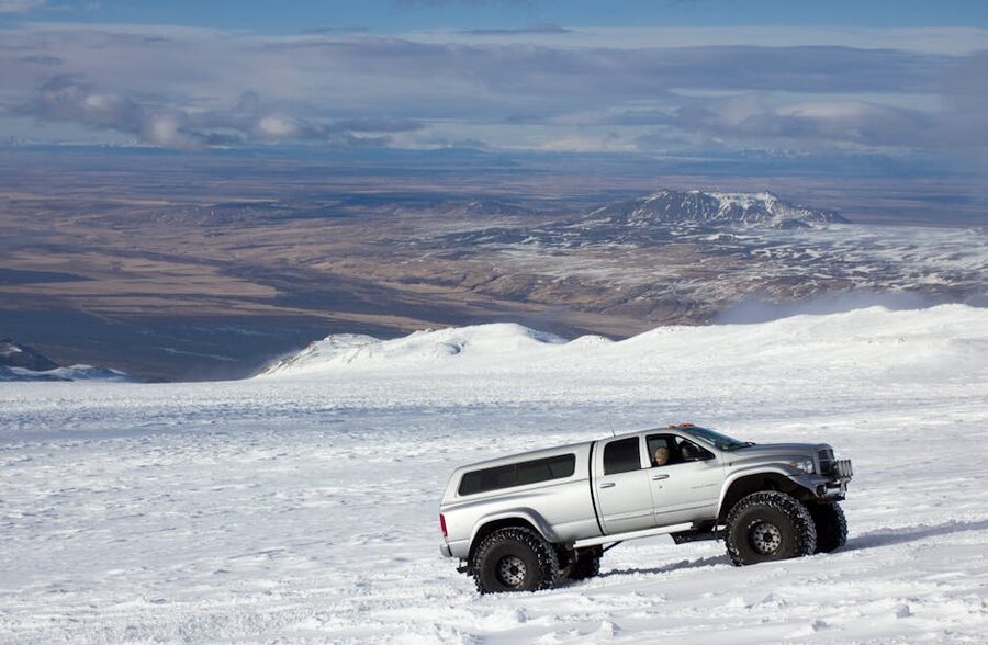 Super jeep on Icelandic glacier snowy terrain Mýrdalsjökull