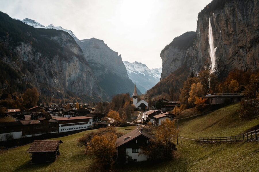 Charming Swiss mountain village with Alpine peaks in the background