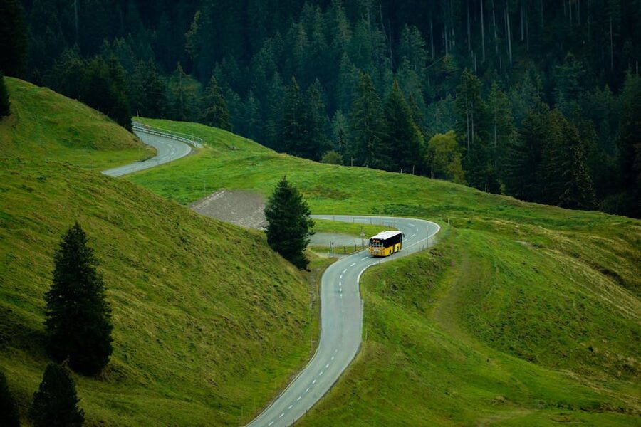 Swiss postbus yellow mountain road