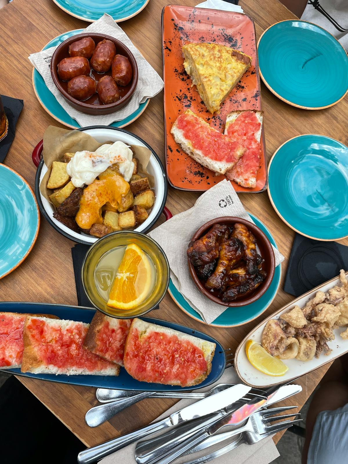 Traditional Spanish tapas served on colorful ceramic plates showcasing diverse flavors