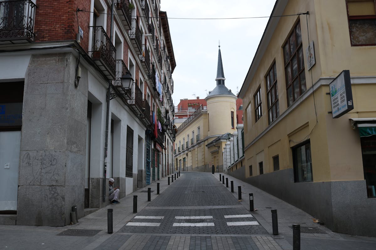 A charming narrow street with historic buildings in central Madrid