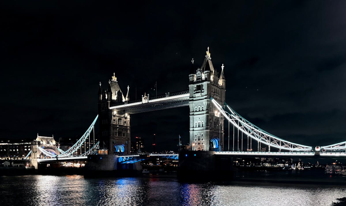 London bridge lit up at night over the Thames