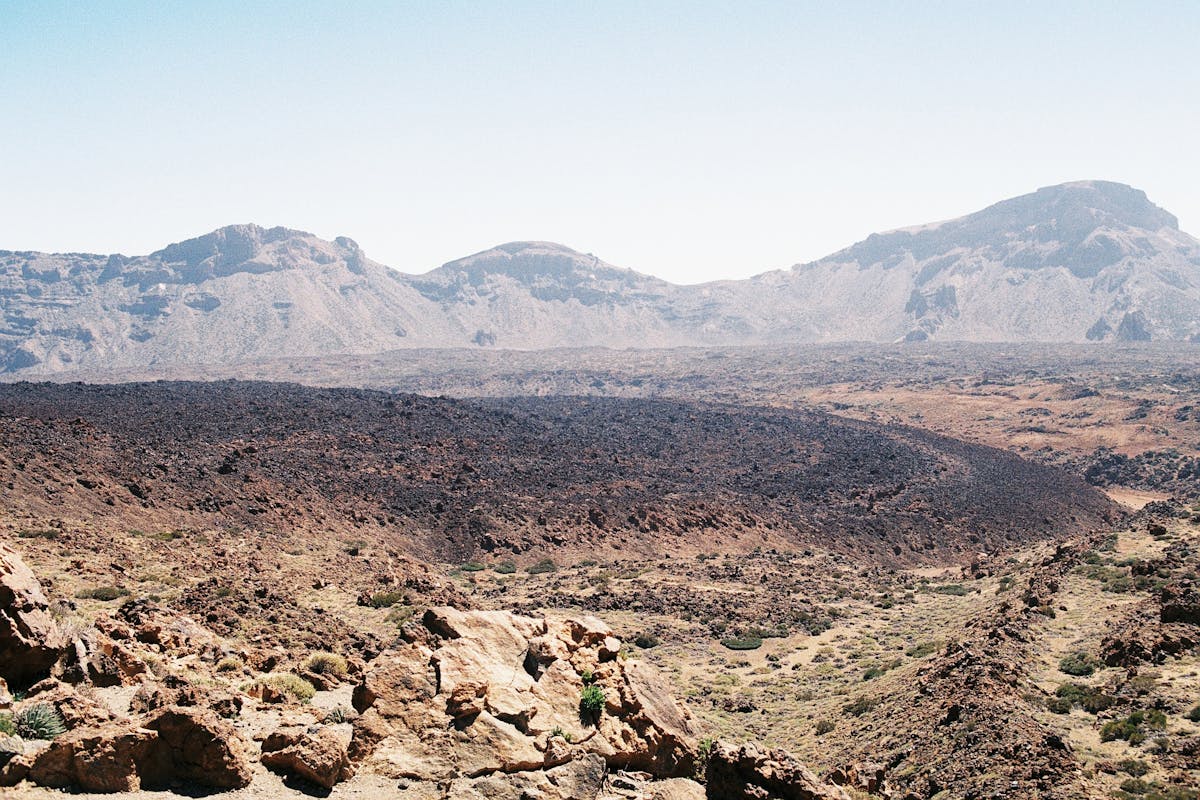 Barren volcanic terrain of Teide National Park with eroded rock formations in Tenerife