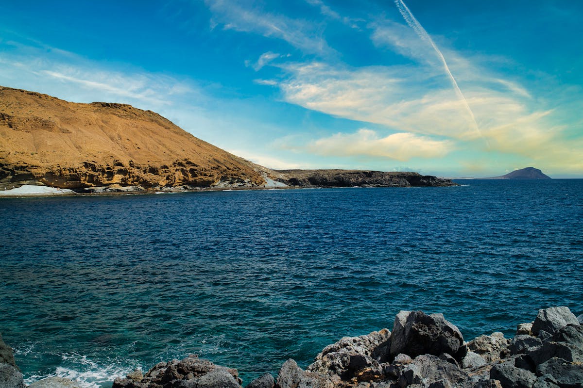 Breathtaking coastal landscape of Tenerife with blue ocean and rugged volcanic cliffs