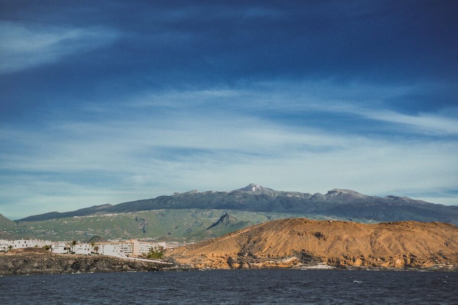 Tenerife coastline with volcanic mountains and clear blue sky