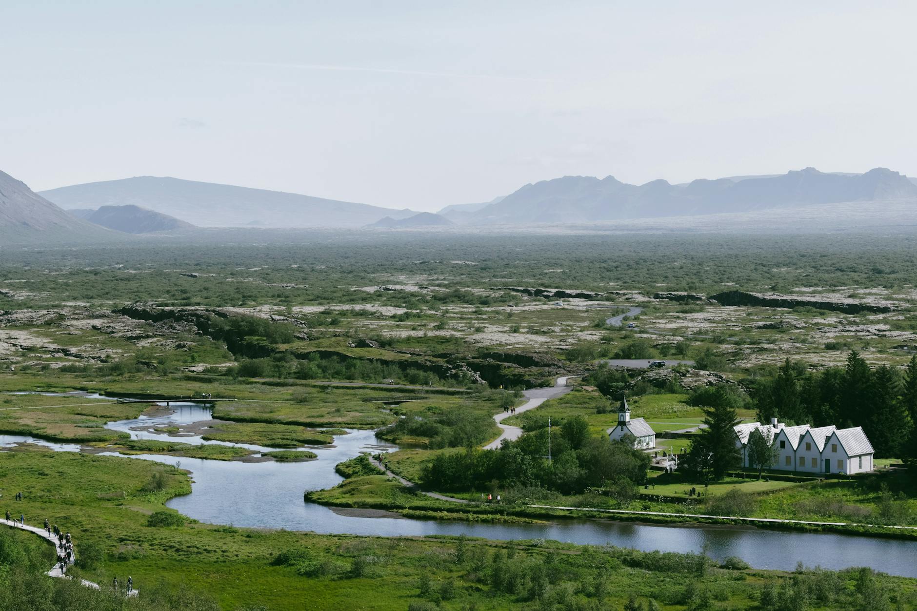 Thingvellir National Park plains with mountains and river in soft Icelandic light