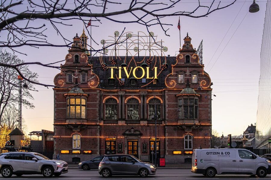 Illuminated facade of Tivoli Gardens entrance in Copenhagen at night