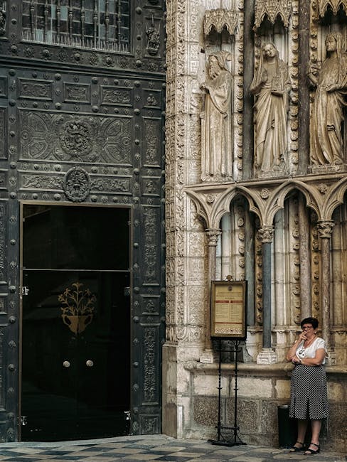An ornate church interior in Toledo with gilded altarpiece and painted ceiling